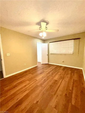 Guest Bedroom #1 with door to walk-in closet