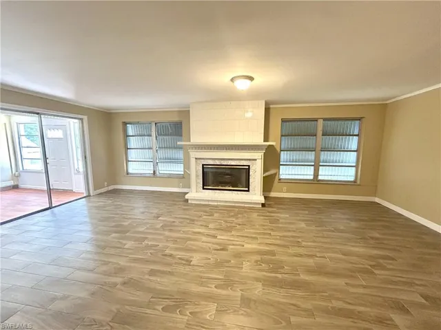 Family room with fireplace and sliding doors to sunroom