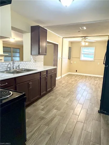 Kitchen with view to breakfast nook with laundry closet