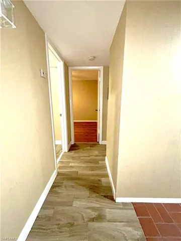 Hallway to guest rooms from front entry to formal dining