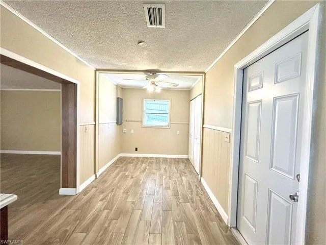 Breakfast area with opening to family room and door to garage on right