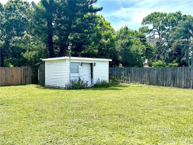 back yard partially fenced