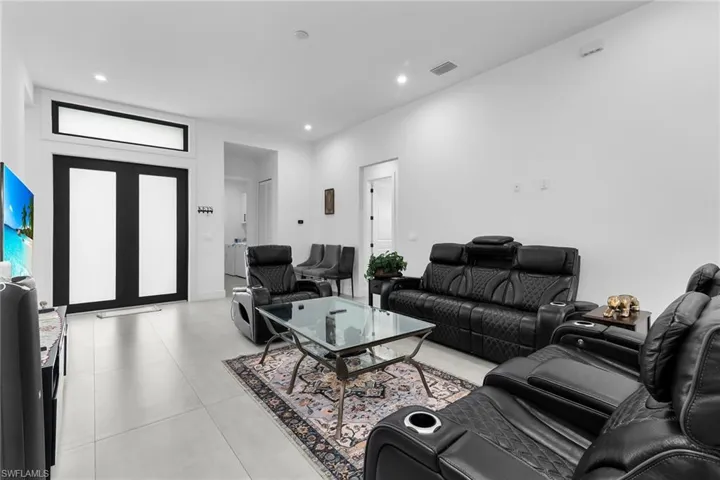 Living room featuring recessed lighting and light tile patterned floors