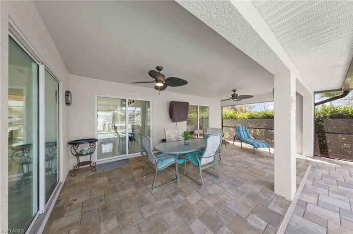 View of patio / terrace featuring outdoor dining area and a ceiling fan