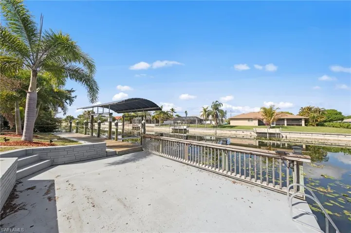 View of patio / terrace featuring a dock and a water view