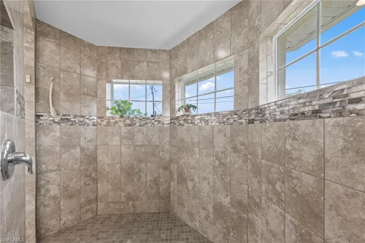 Full bathroom featuring a tile shower
