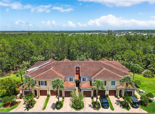 View from above of property featuring a heavily wooded area
