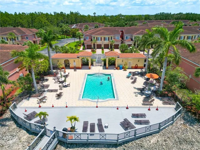 Community pool with a patio