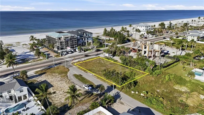 Aerial overview of property's location with property parcel outlined and unending shoreline - Virtually Edited Image