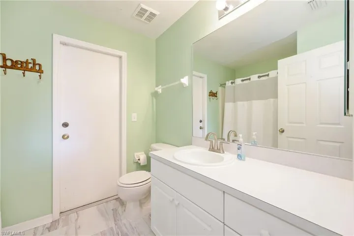 Bathroom with vanity and toilet