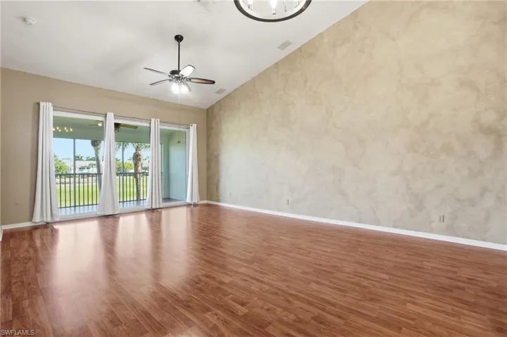 Living area featuring faux painting and laminate flooring.