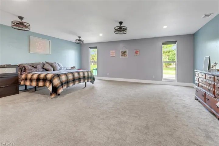Bedroom featuring recessed lighting, baseboards, visible vents, and carpet floors