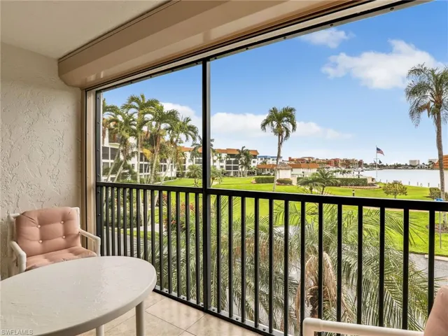 Screened In Tiled Lanai with New Hurricane Shutter and Bay View