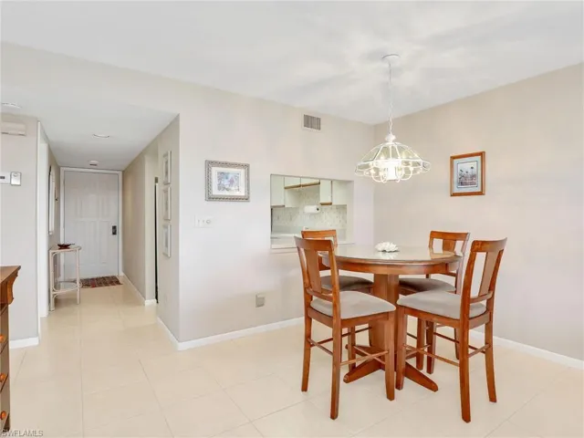 Dining Area with Chandelier, Pass Through to the Kitchen and Front Hallway