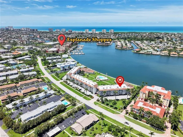 Aerial Side View of the Building Overlooking the Bay and Proximity to Esplanane Shoppes