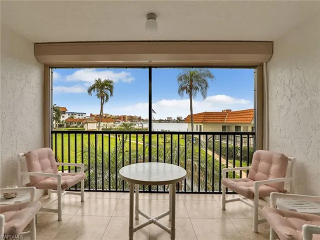 Screened In Tiled Lanai with New Hurricane Shutter and Bay View