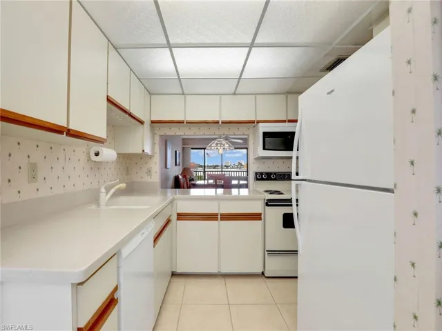 Kitchen with Corian Counters and New Whirlpool Refrigerator