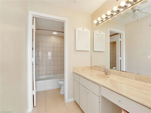 Primary Ensuite Bathroom with Large Vanity and Separate Tub/Shower Combo and Toilet Room