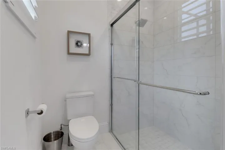 Bathroom with toilet and a shower stall
