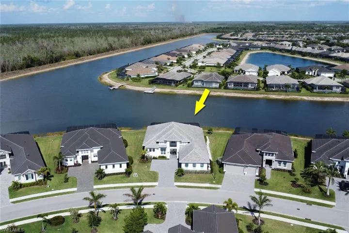 Aerial view of residential area with a large body of water