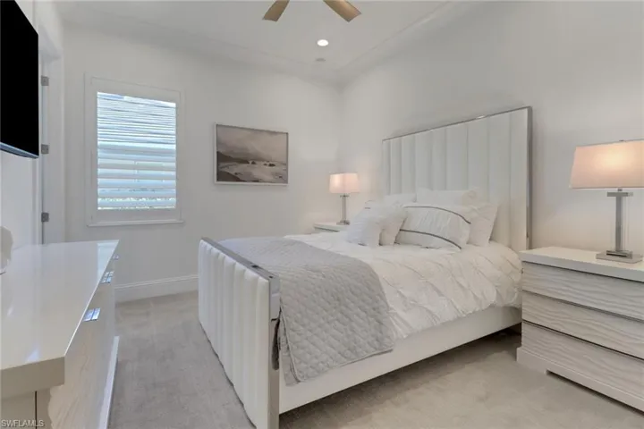 2 Bedroom featuring light carpet, a ceiling fan, and recessed lighting, on suite bathroom