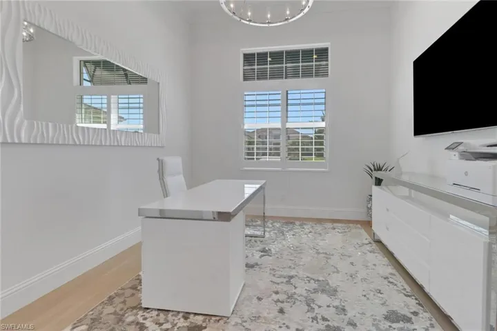 Office, Desk, Cabinet, TV and with  a chandelier