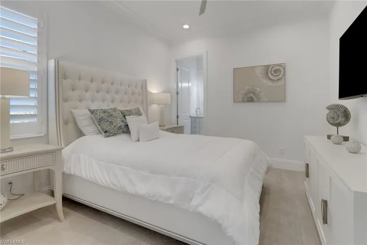 4th Bedroom featuring light colored carpet, recessed lighting, ceiling fan and connected on suite bathroom,