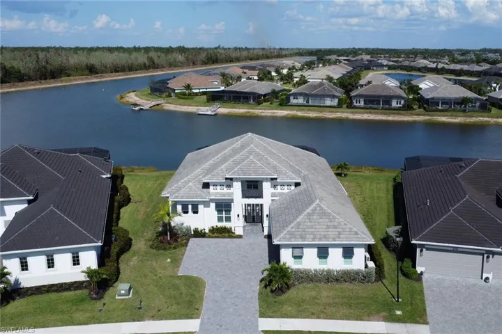 Aerial perspective of suburban area with a large body of water
