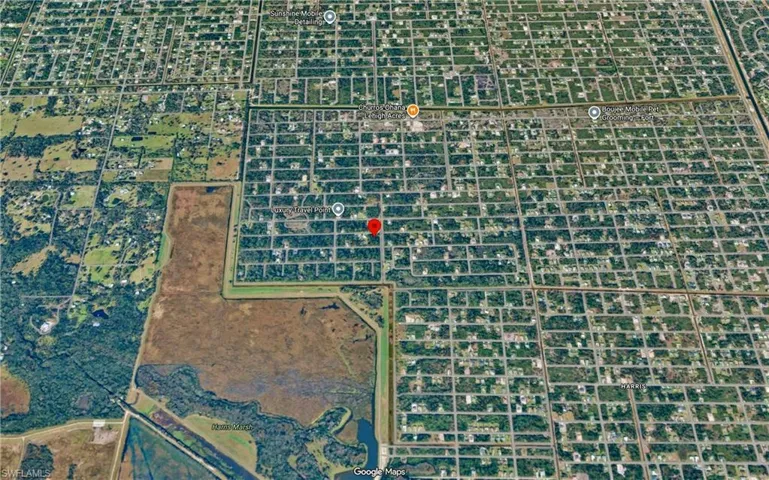 Aerial Map. Displaying the property's location within a grid-patterned development and surrounding geographic features