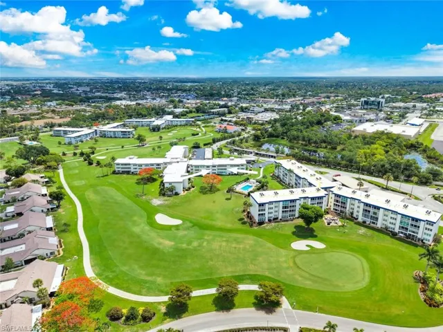 Aerial perspective showcasing expansive green golf course grounds
