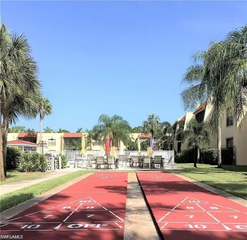 View of home's community with shuffleboard