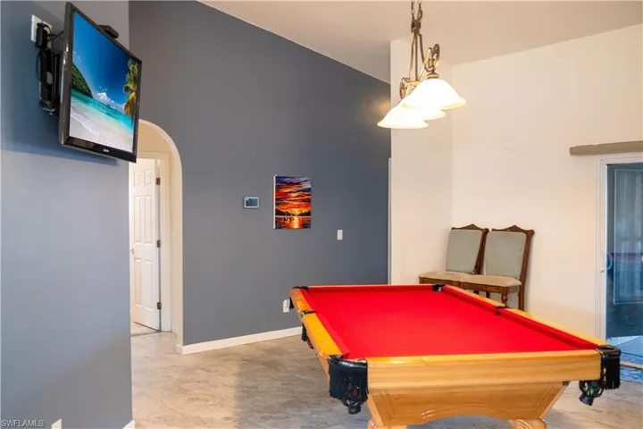 Rec room featuring baseboards, billiards, and arched walkways
