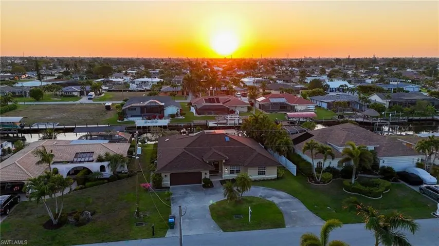 Bird's eye view featuring a residential view with sunset and the front of the home