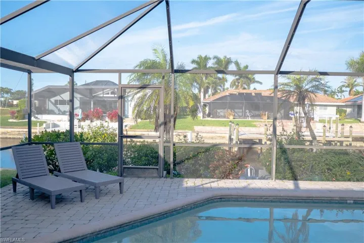 Pool with enclosure and a patio