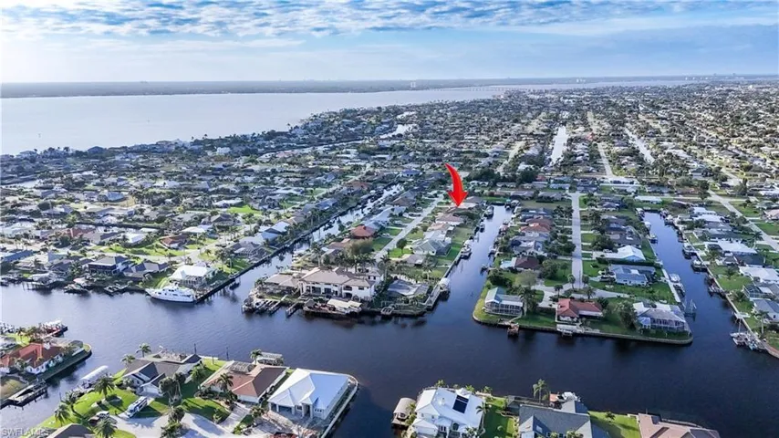 Aerial view featuring a water view and a residential view