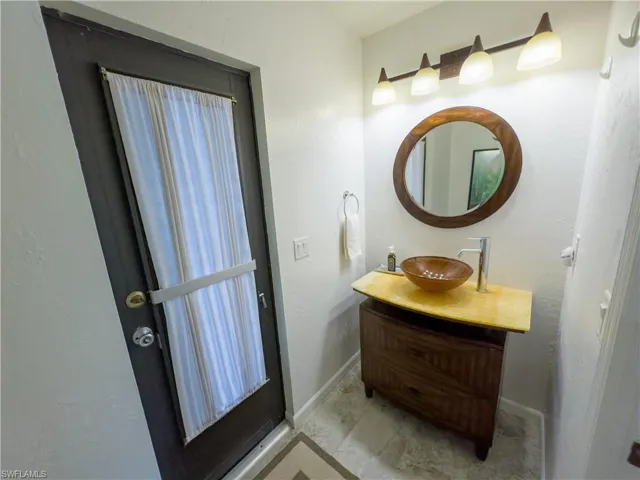 Bathroom featuring baseboards and vanity