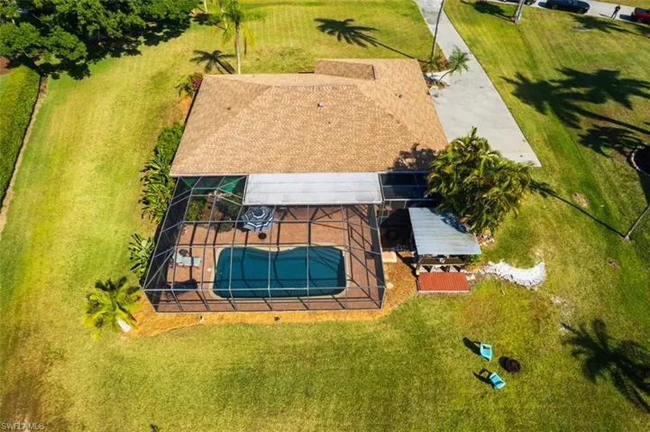 View of subject property featuring a pool