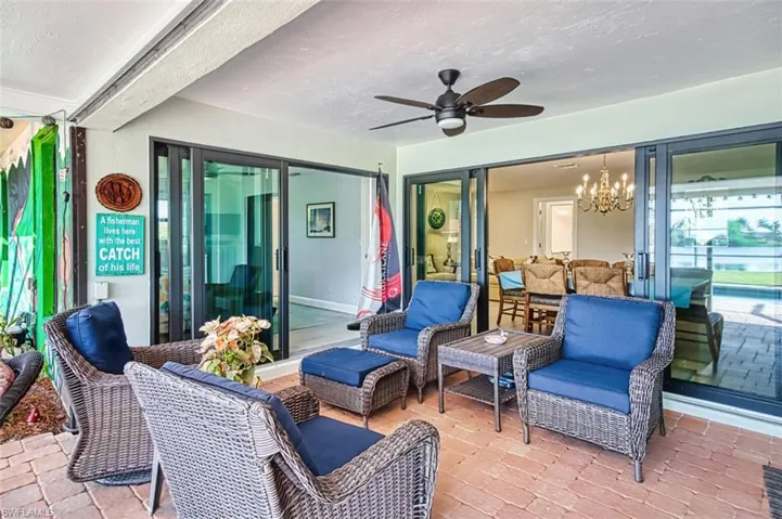 View of patio featuring ceiling fan