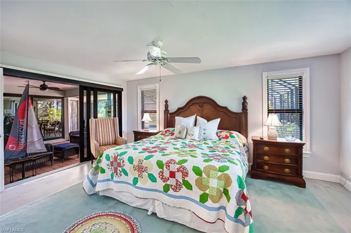 Bedroom featuring access to outside and ceiling fan