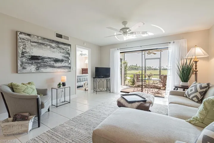 Living room with sliders leading to lanai.