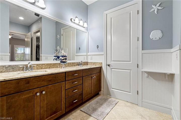 Master bathroom with framed mirror