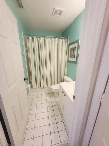 Bathroom featuring vanity and light tile patterned floors