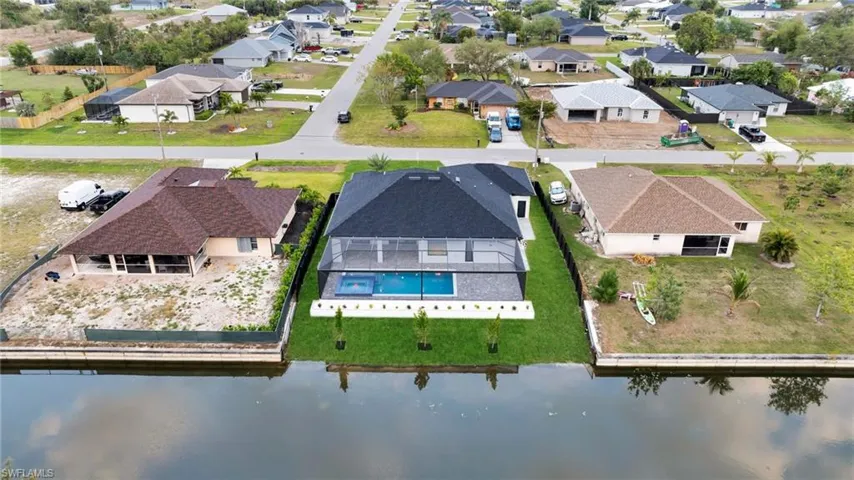 Aerial view with a water view and a residential view