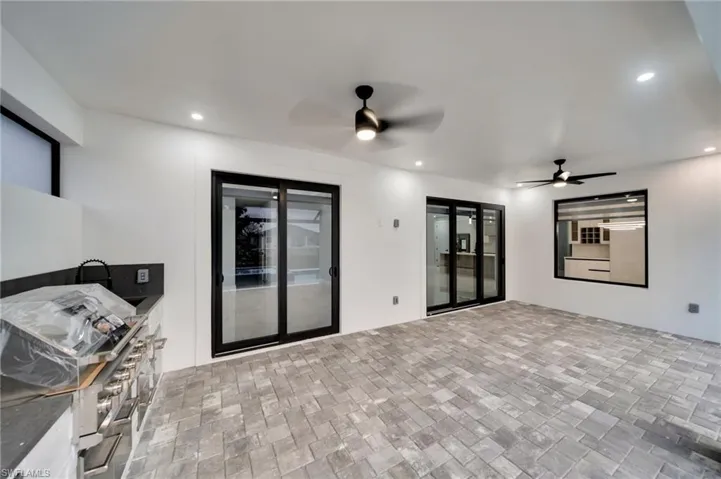View of patio featuring a ceiling fan