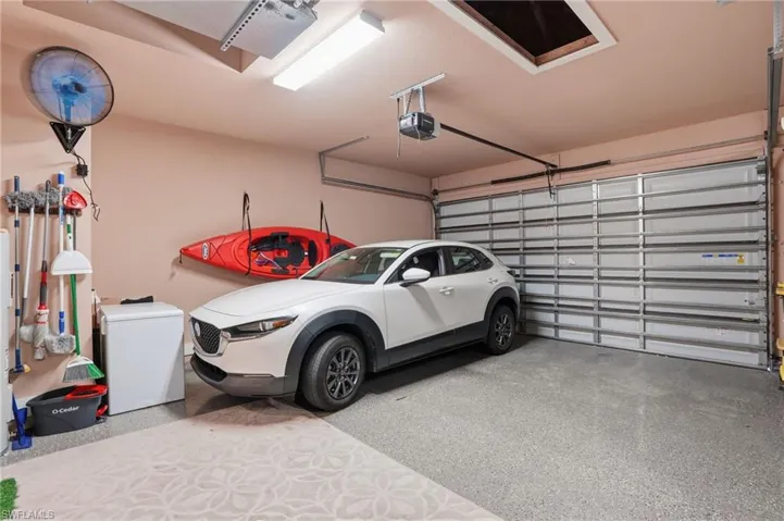 Garage featuring a garage door opener