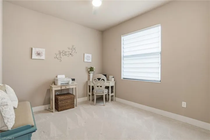 bedroom with carpet floors and baseboards