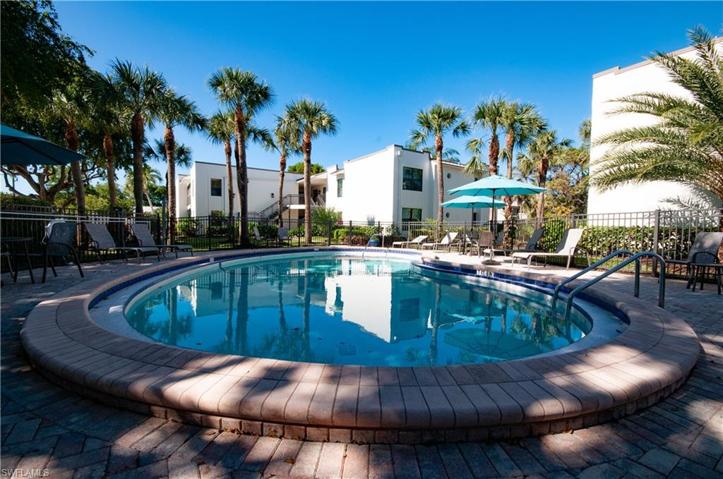 Heated Pool fitted with tables chairs  umbrellas