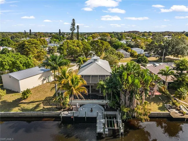 View from above of property with a nearby body of water