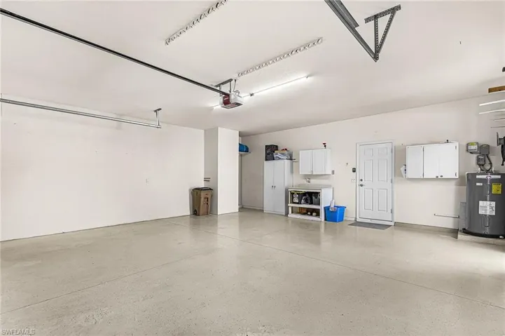 Garage featuring water heater