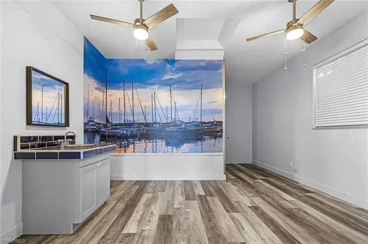 Unfurnished dining area featuring ceiling fan and light wood finished floors
